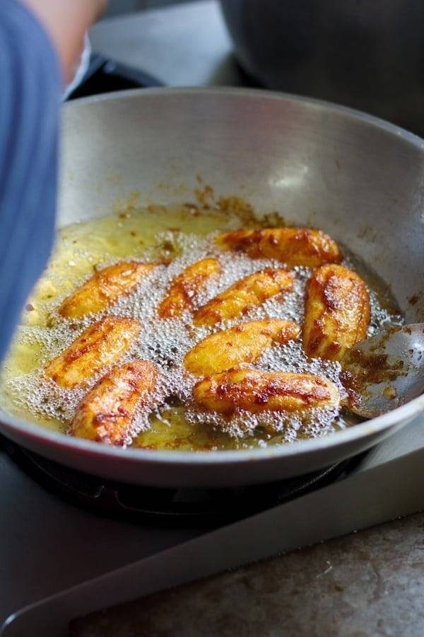 Banana cue sizzling in a pan.