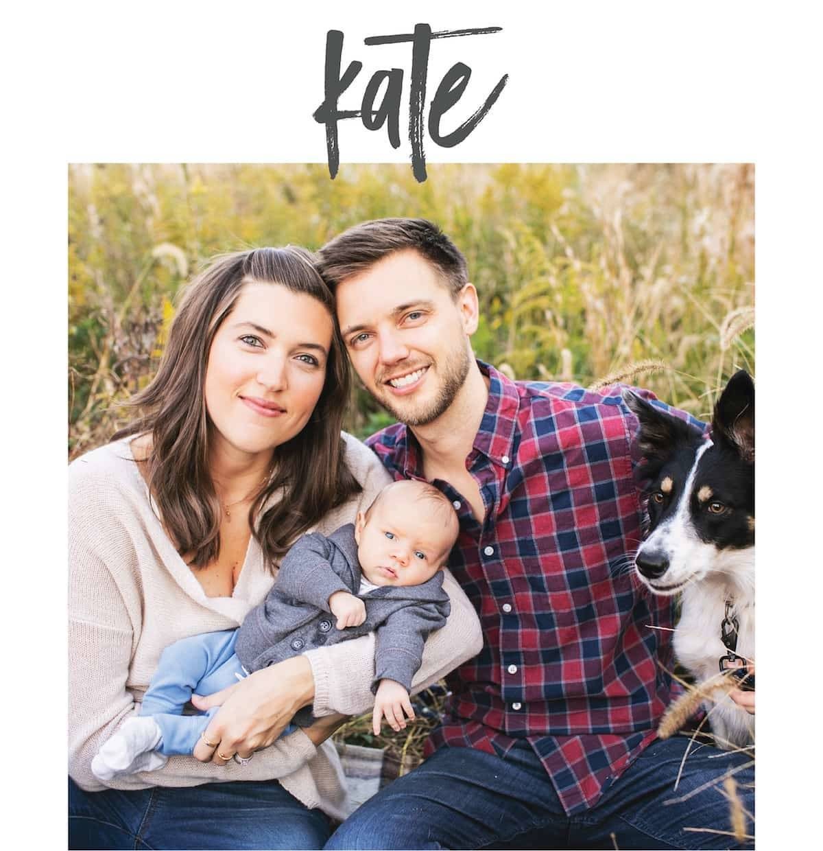 A man and a woman together with a baby and a dog.