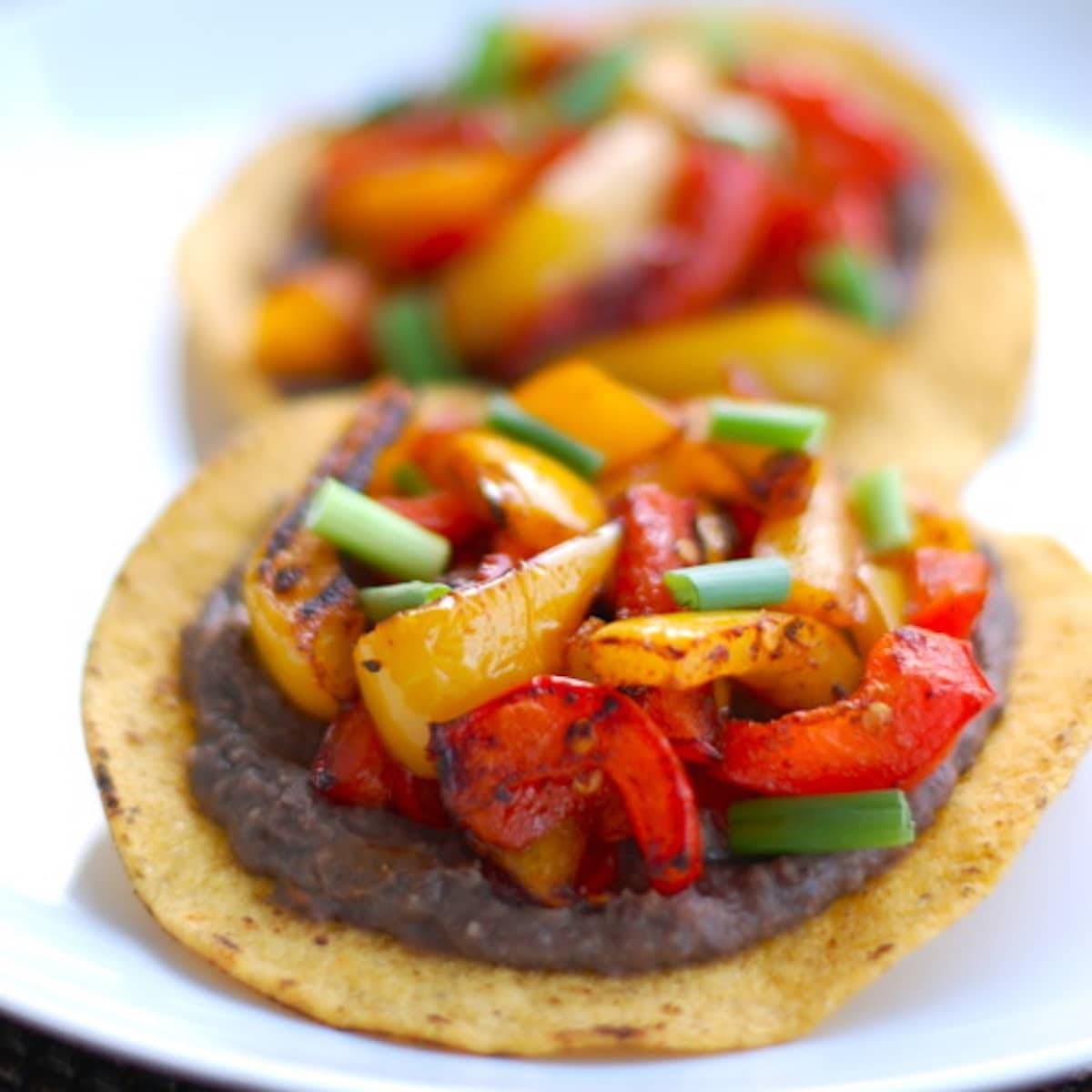 Two roasted bell pepper tostadas.