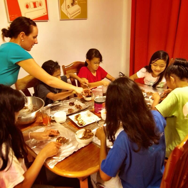 Young children around a table.