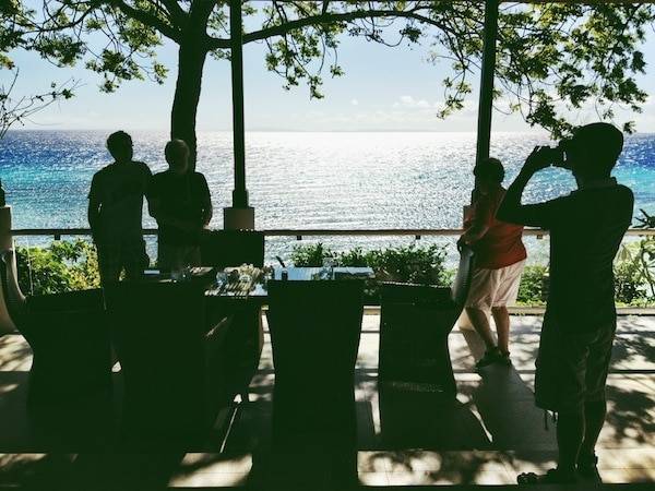 People looking out at the ocean.