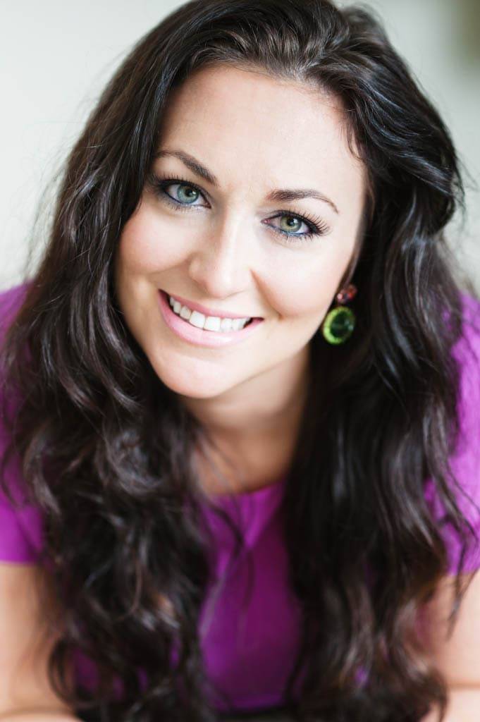 Woman smiling at camera.