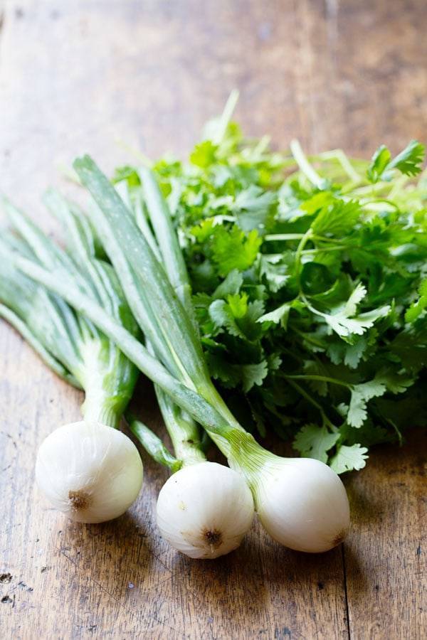 Herbs on a wooden surface.