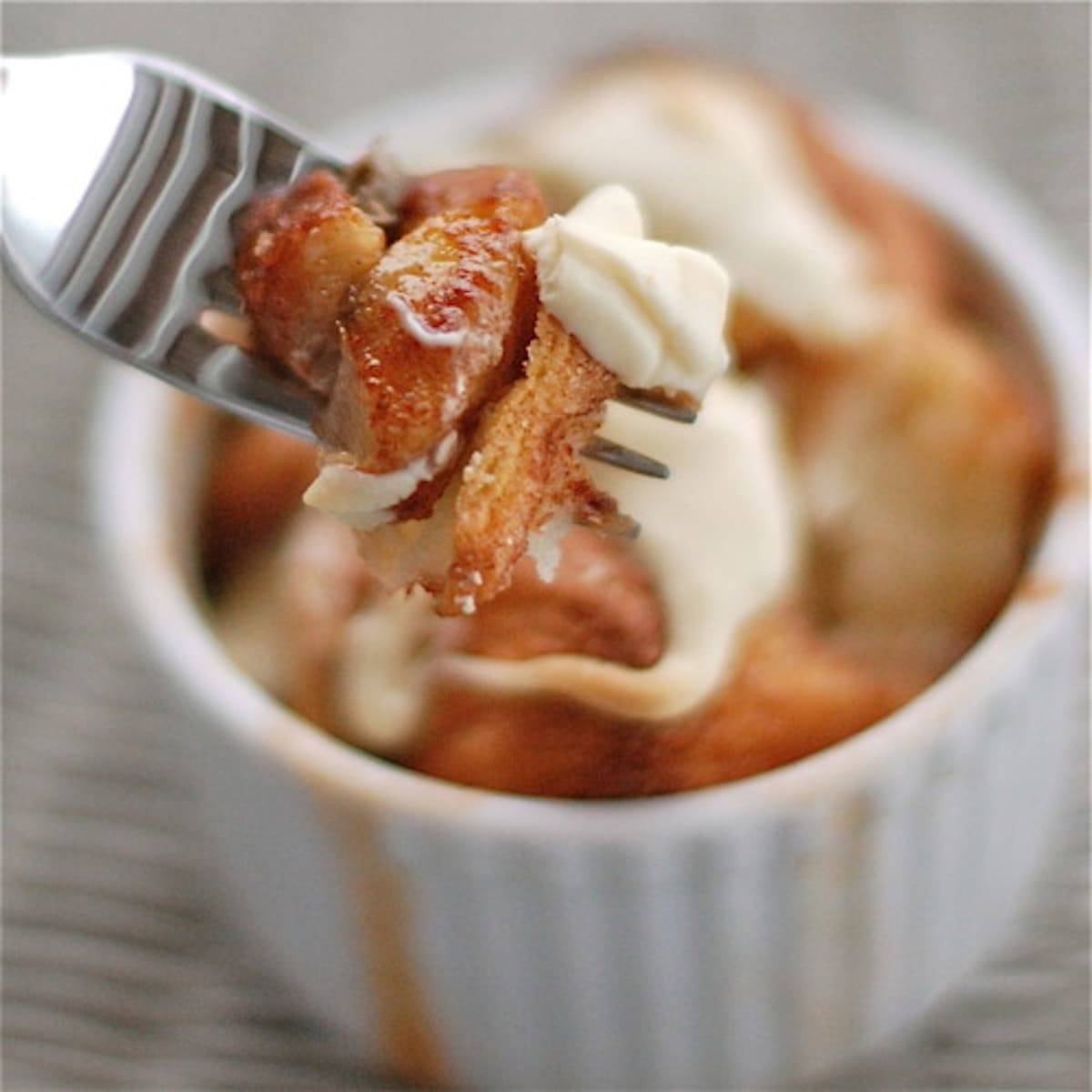 Banana monkey bread on a fork with frosting.