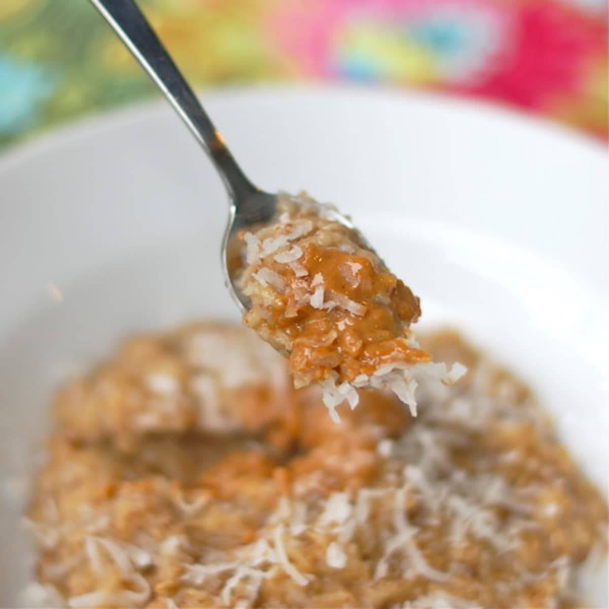 Coconut peanut butter oatmeal on a spoon.
