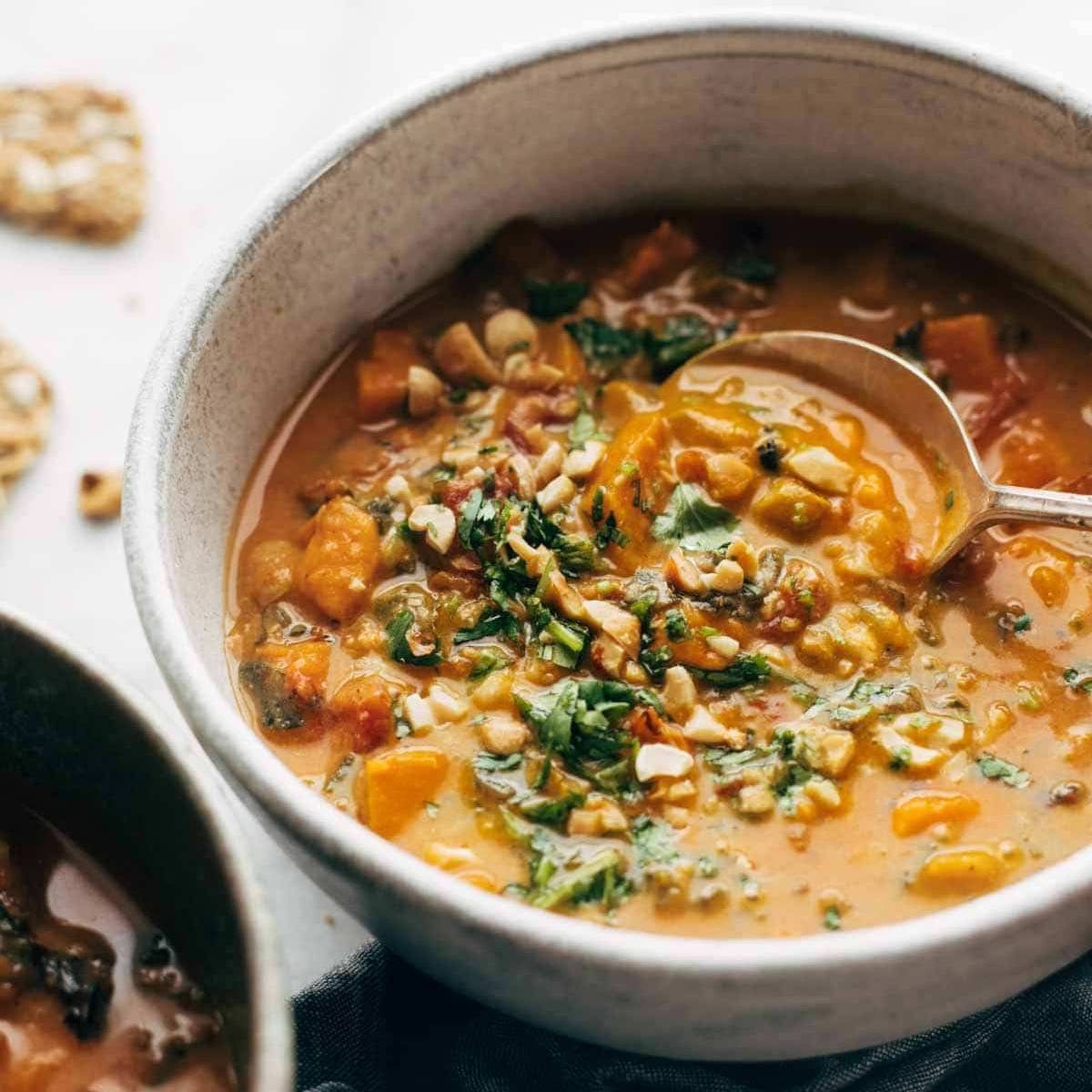 Spoon scooping sweet potato stew