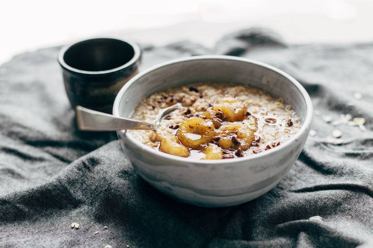 Caramelized Banana Oatmeal! Creamy oatmeal with bananas in a maple syrup/coconut oil glaze. No refined sugar! | pinchofyum.com